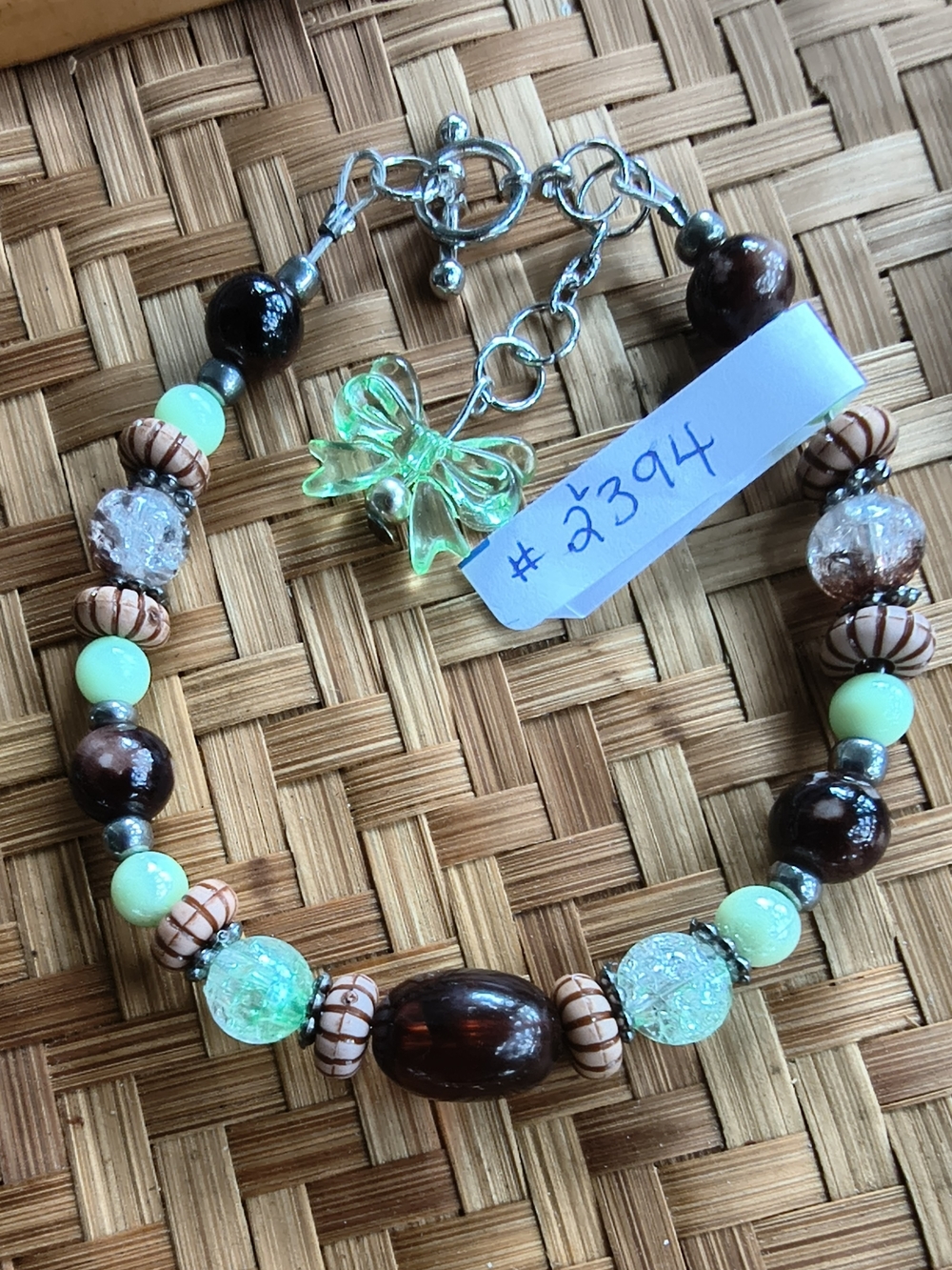Handcrafted Brown and Mint Beaded Bracelet with Green Bow Charm